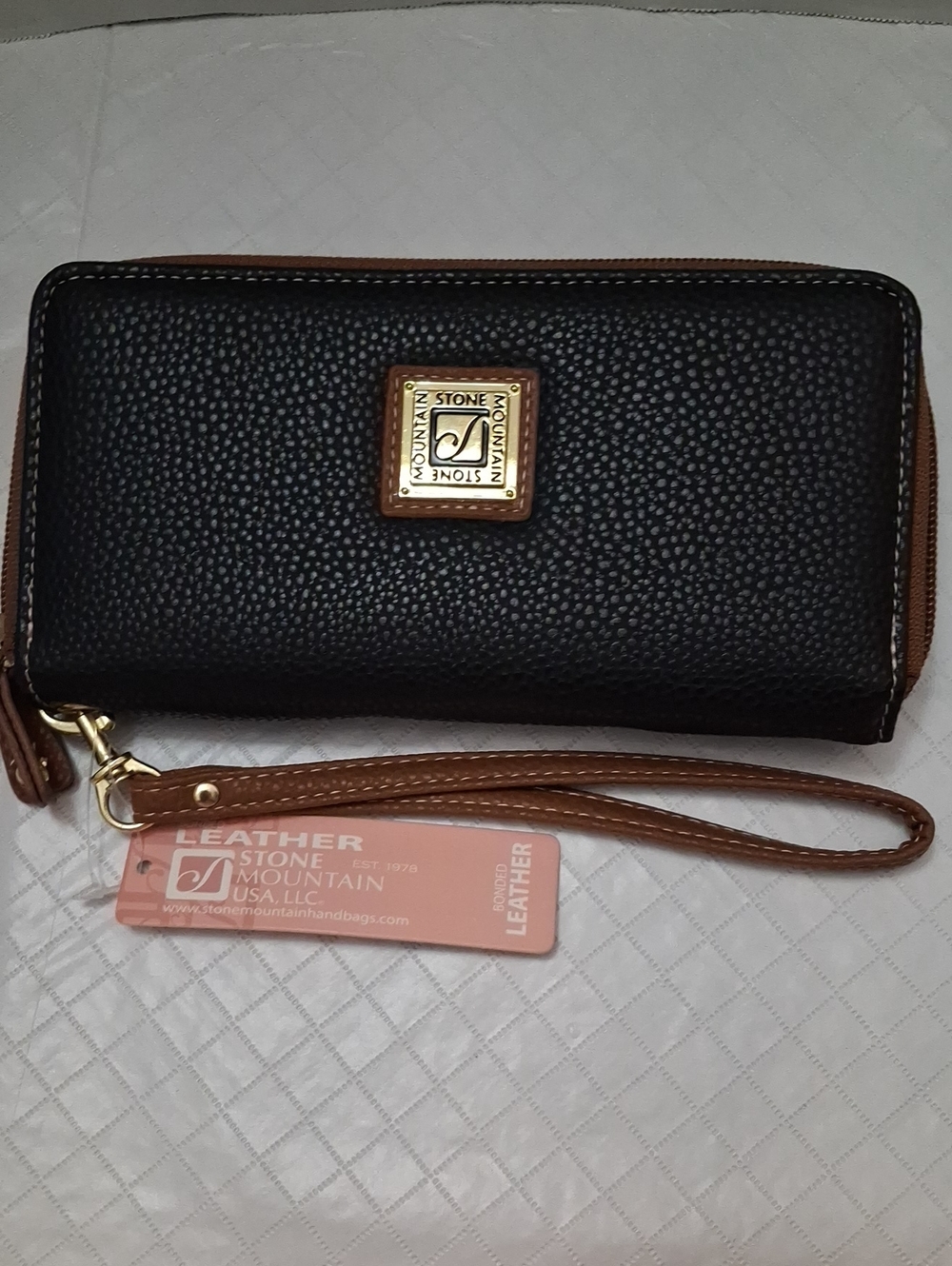 Stone Mountain Large Black, Tan Pebbled Leather Zip Multi Compartment Wristlet.